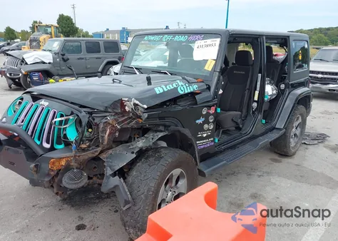 2016 Jeep Wrangler Unlimited Sahara z USA, uszkodzony, nr VIN 1C4HJWEG8GL334973